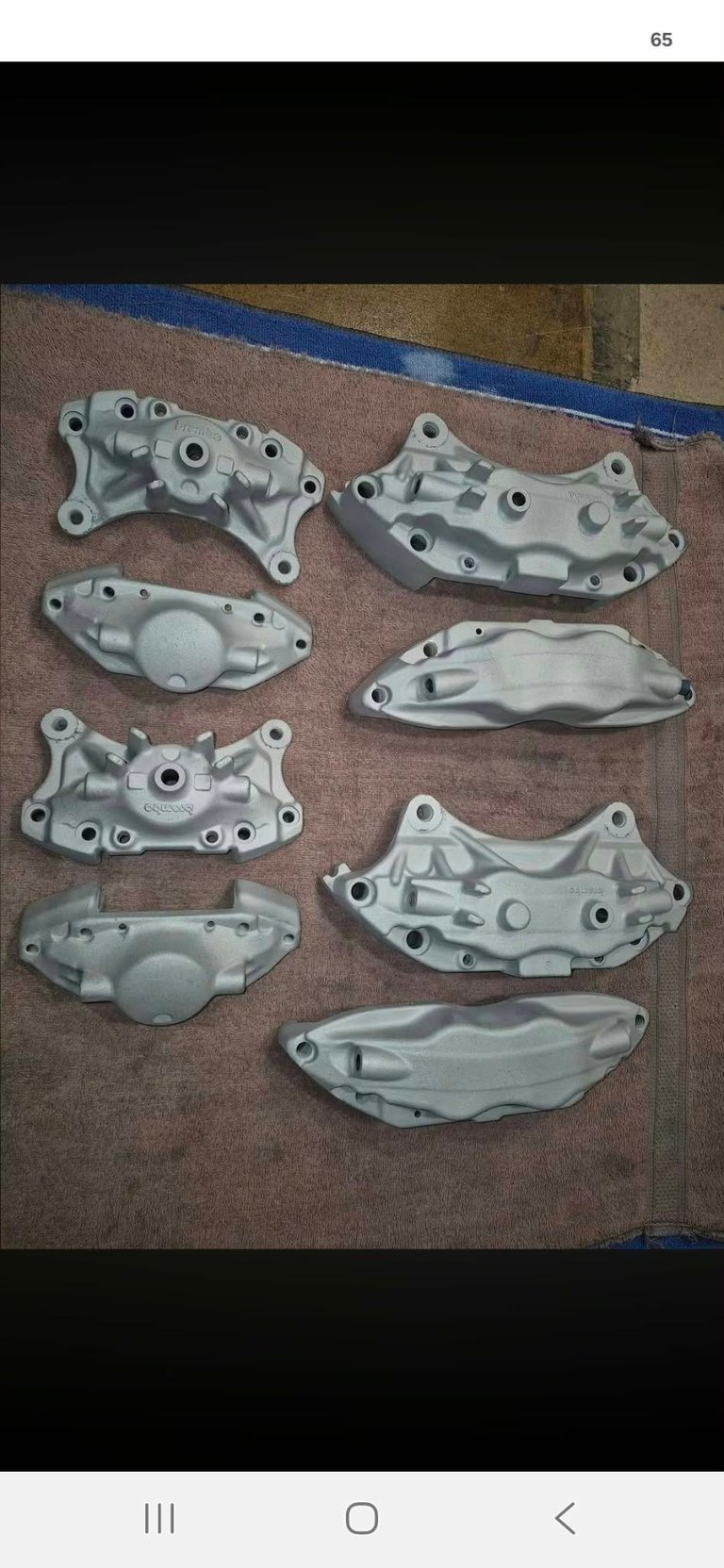 Group of restored silver brake calipers after restoration